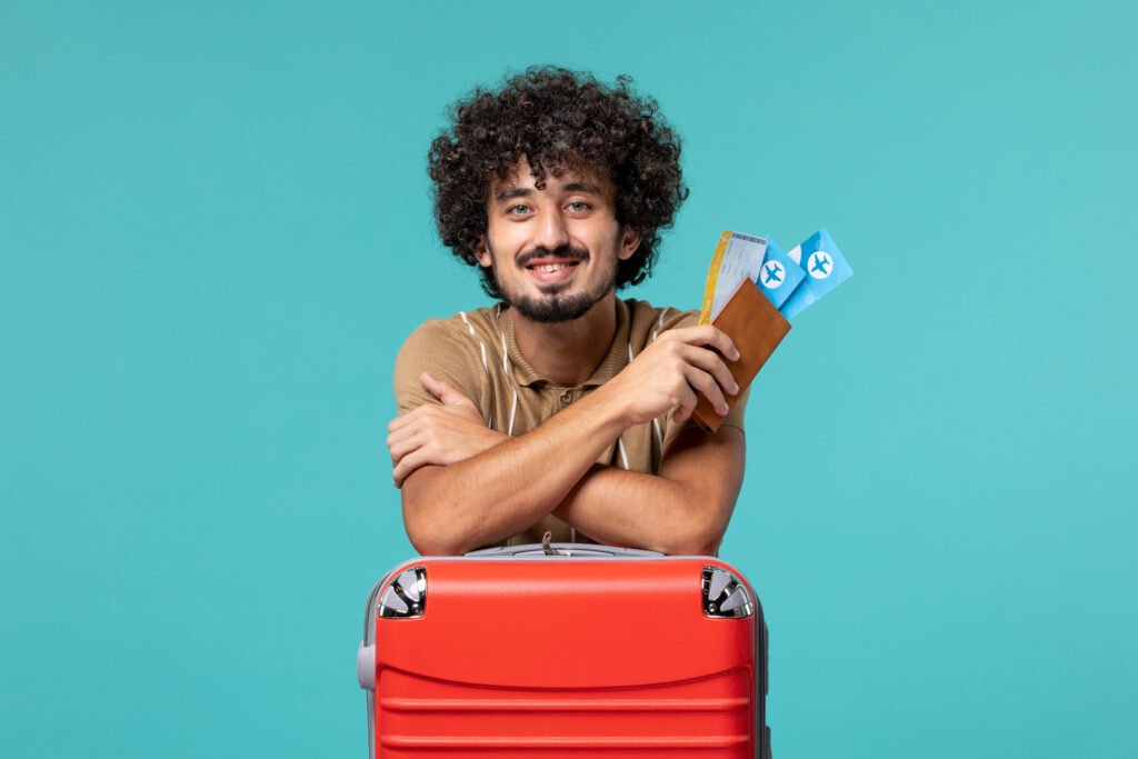 man vacation holding tickets leaning his red bag blue
