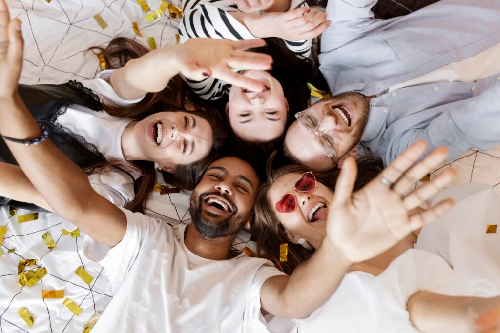 top view happy people laying together