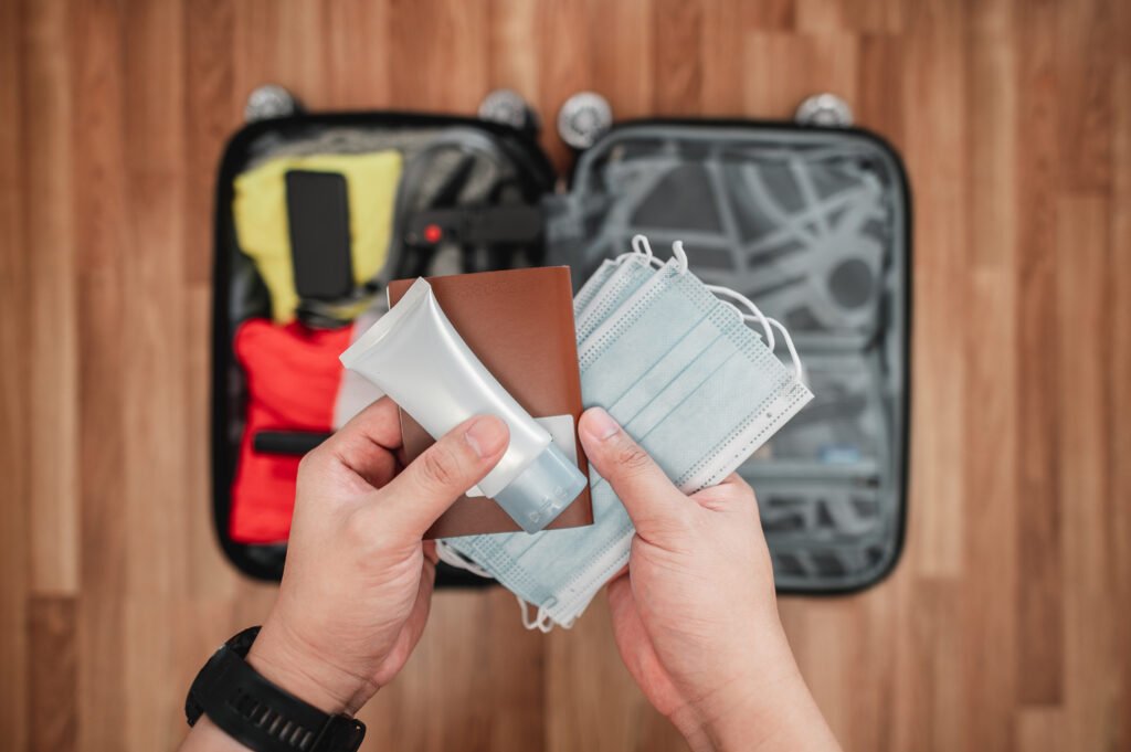top view of preparing suitcase for summer vacation trip